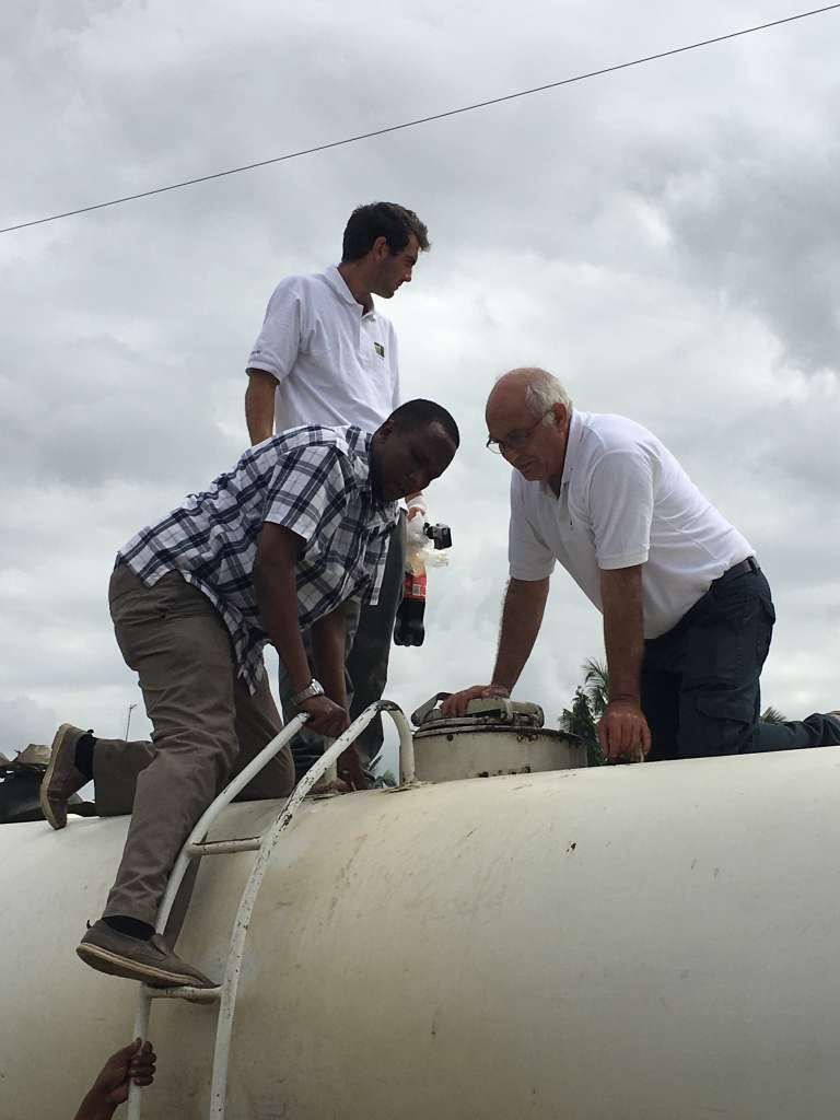 Adding the enzyme concentrate to the water tanker